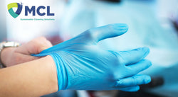 Worker putting on Protective Gloves with MCL Logo